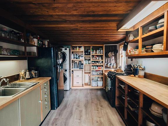 Cozy kitchen, exposed wood beams.