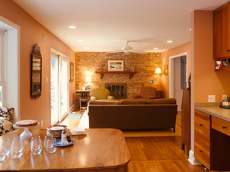 Kitchen eating area and den with gas fireplace.