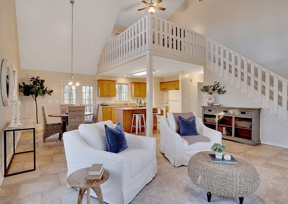 Living/Dining area of great room that leads to deck on eastern brow of mountain.