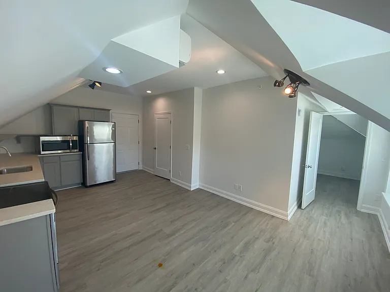 Kitchen & Living room plus hallway leading to bedroom
