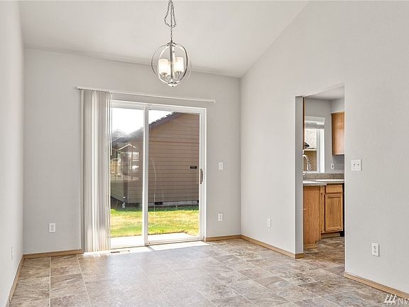 Conveniently located off the kitchen and living room, the gracious dining nook caters to both formal and informal dining. 