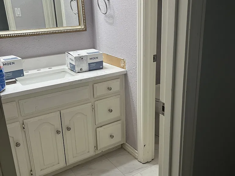 Upstairs Hallway bathroom, shared space for occupants of the two secondary bedrooms. Remodeling almost complete with new walk in tiled shower, flooring, & sink. New photos forthcoming.