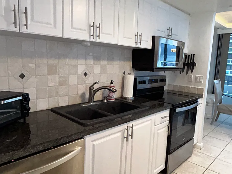 View of kitchen sink and dishwasher