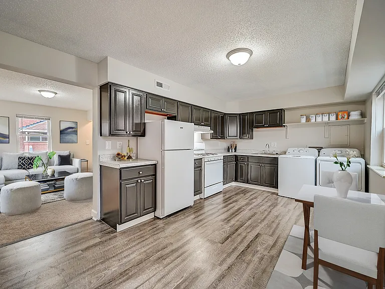 3 BR 2 BA Recently Renovated Townhouse Style Apartments featuring New gray carpet, Neutral paint scheme, Premium hardwood-style flooring, Neutral paint scheme, Upgraded light fixtures, New cabinets, Matching stainless steel appliances, Washer/Dryer, Air c