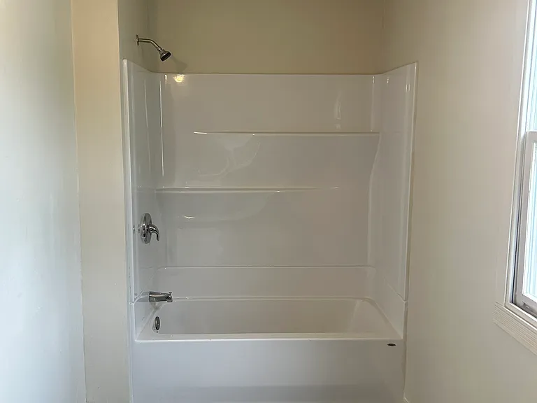 Brand-new shower, flooring and updated bathroom.