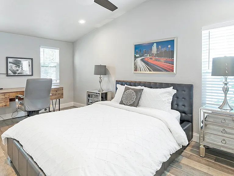 Larger master bedroom with King Bed and vaulted ceilings, with optional natural light