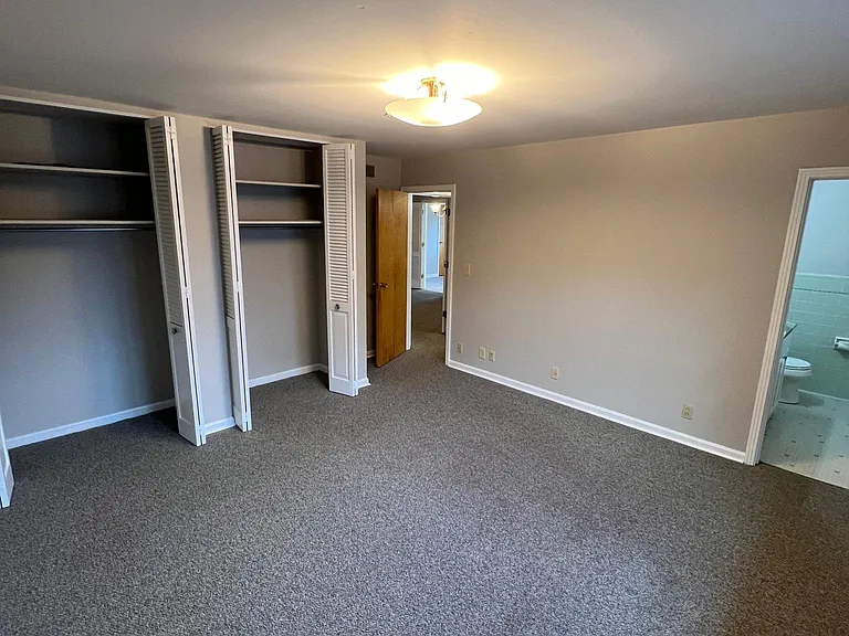 Closets and half bath in main bedroom
