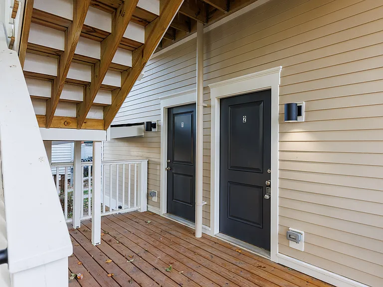 Exterior entrance leading to the parking lot and deck.