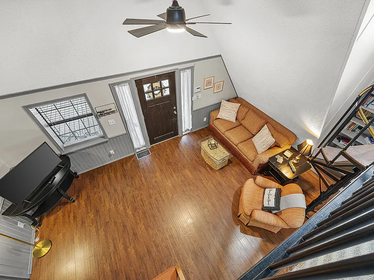 Loft bedroom overlooks living room