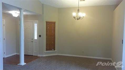 Foyer that is adjacent to the formal dining area.
