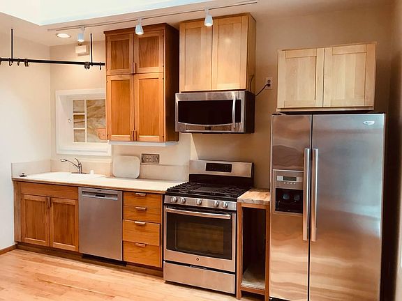 Renovated kitchen with brand-new stainless steel appliances (photo in morning)