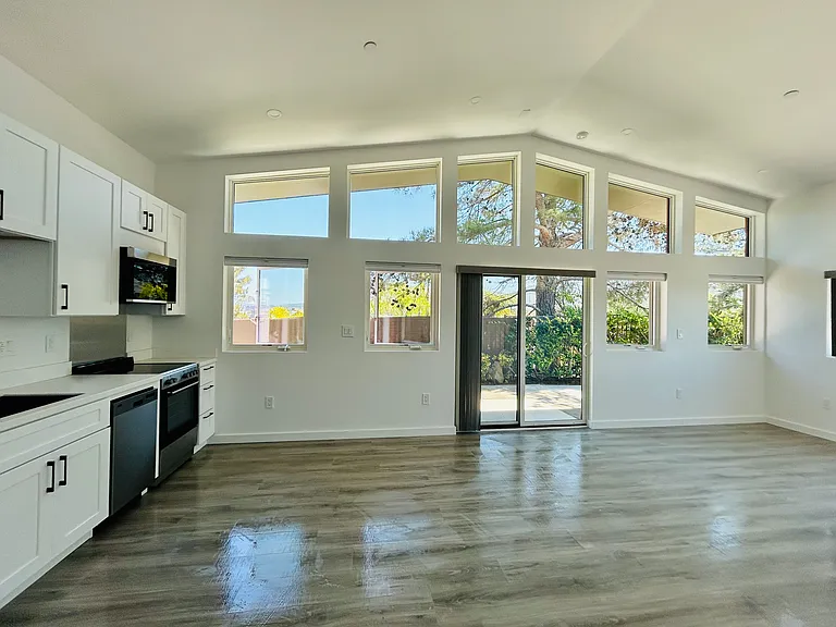 Vaulted Ceilings, open floor plan with beautiful Marvin Windows!
