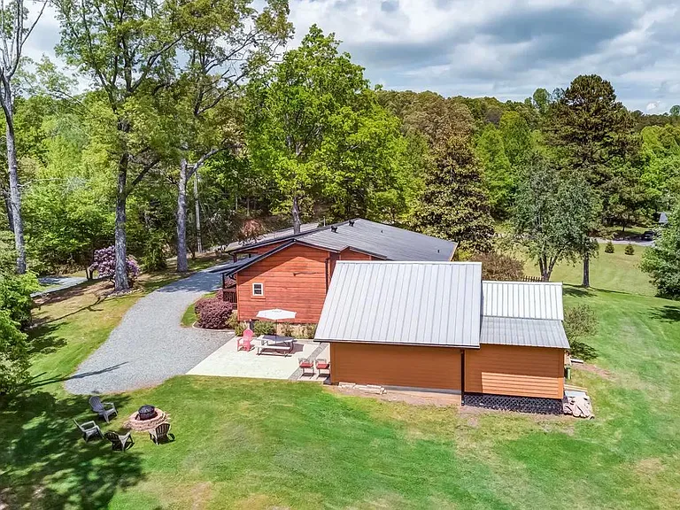 Drone view of property well maintained 2.5 acres of serene nature.
