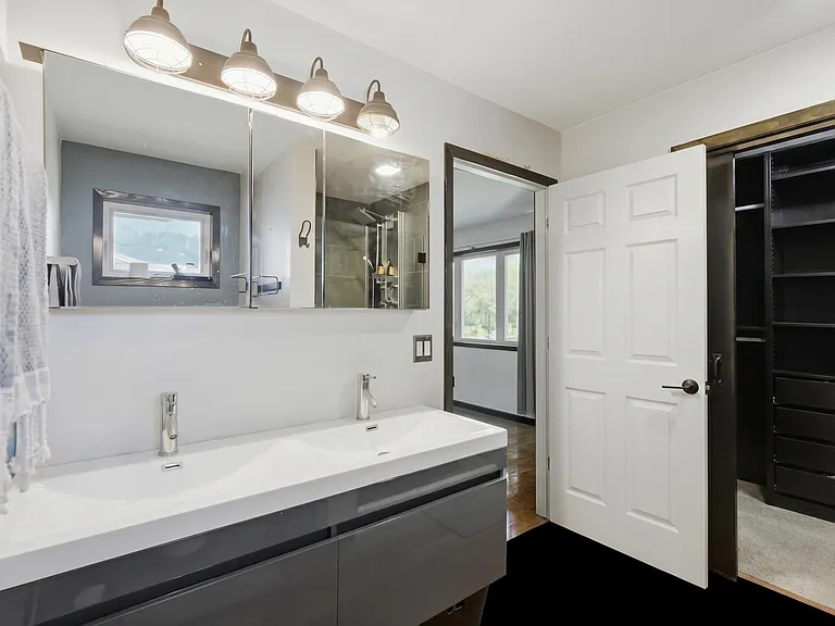 Primary suite bathroom and walk-in dressing room, 5122 Marathon Drive