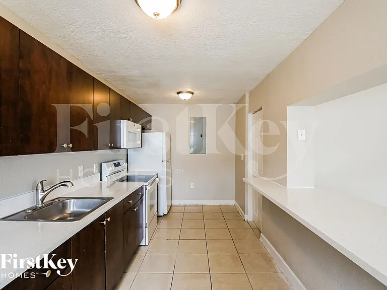 5980 NW 24th Ct — Photo 7