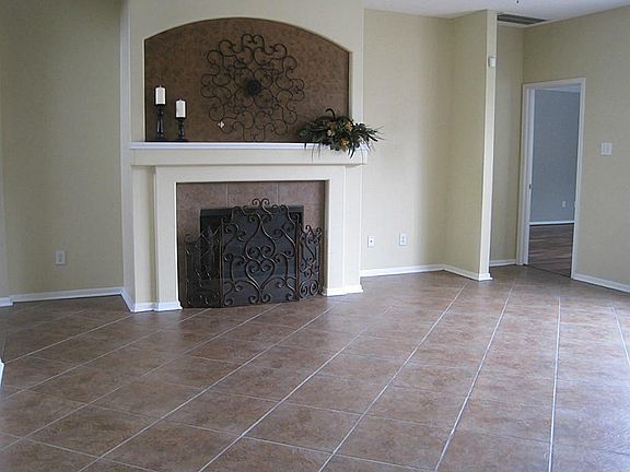Spacious Living Room with gas fireplace and lots of natural light.