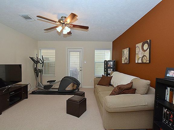 Just off the foyer is the first bedroom which is being used as a gameroom. This room opens to be bac