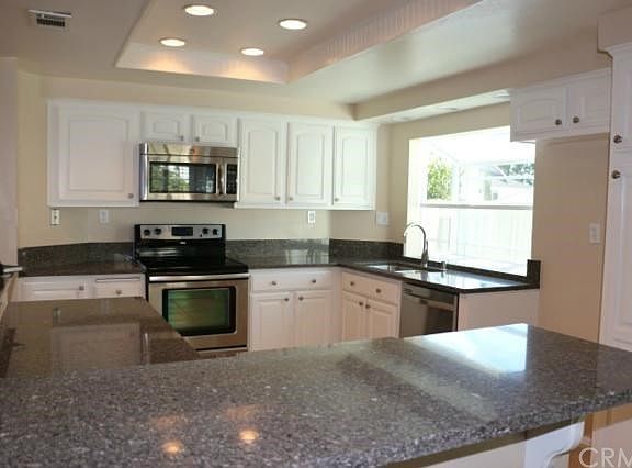 Remodeled Kitchen with Recessed Lighting and Garden Window