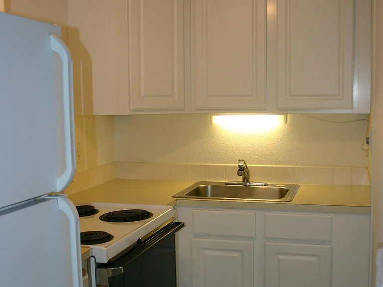 Efficient kitchen, new refrigerator and plenty of cupboard space.