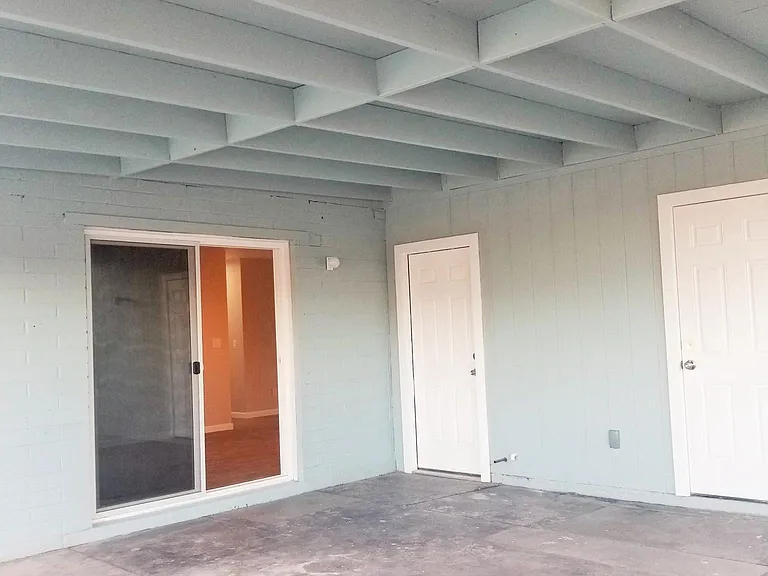 huge covered patio and access to dining room, garage, and laundry room
