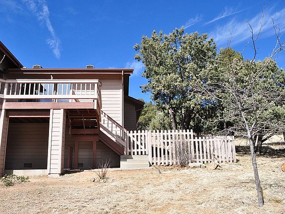 back of house and fenced gar