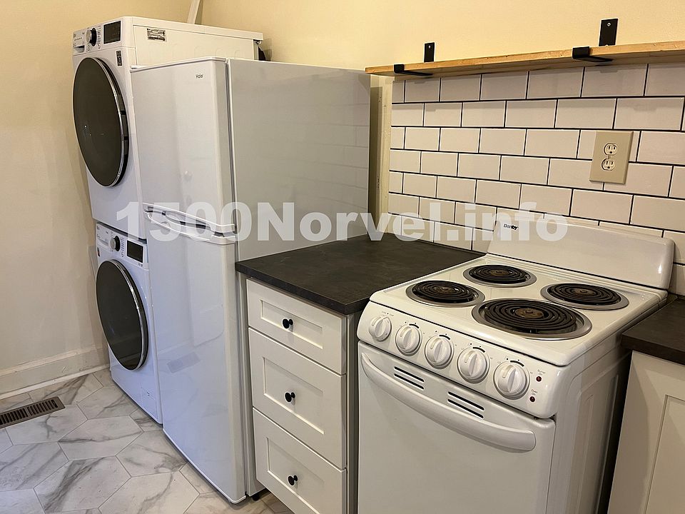 Updated kitchen and appliances including stackable washer and dryer