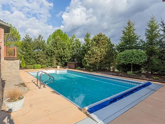 Go ahead. make a SPLASH!! Gorgeous in ground swimming pool with automatic cover. Hot tub is in the back corner for privacy.