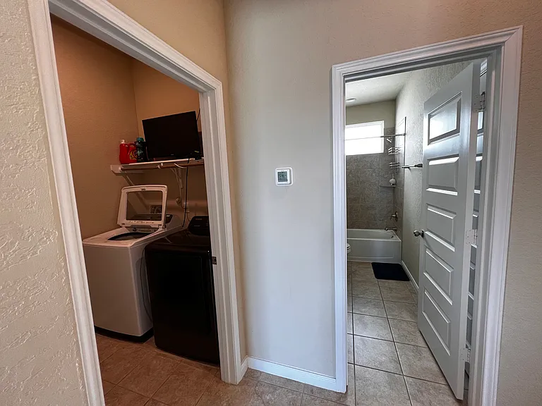 Utility room with new washer and dryer, 2nd full bathroom