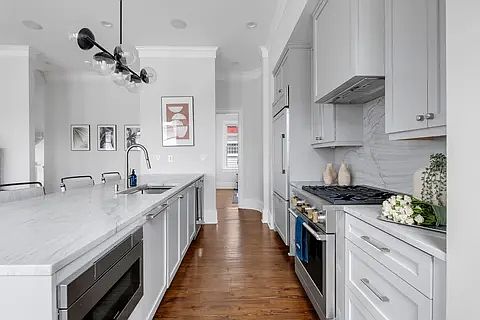 Fully equipped kitchen with stainless steel appliances.