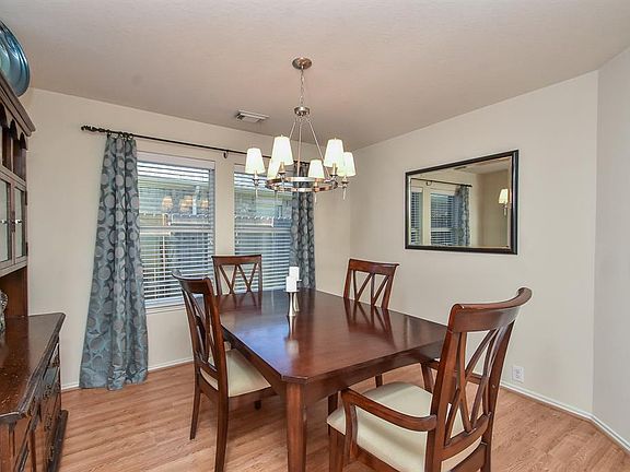 Spacious formal dining area. Wood laminate flooring thru-out the downstair makes for easy maintenance.
