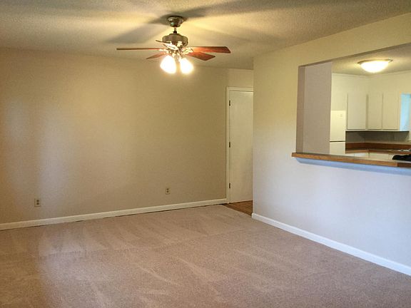 Living room open to kitchen.  Door to double garage.