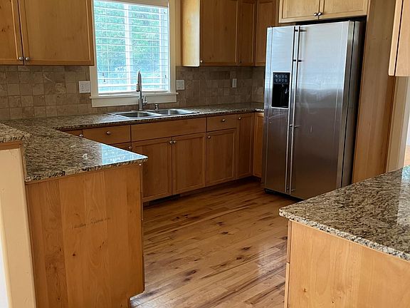 Large kitchen with stainless appliances