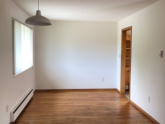 Dining room with newly refinished hardwood floors.