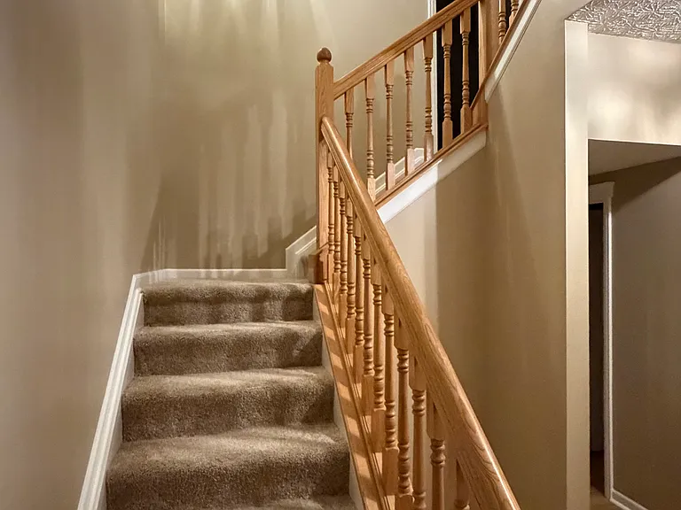 Stairway to the split-level bonus room.
