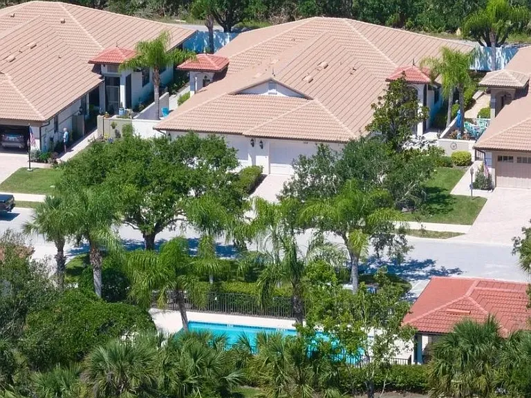 View of home near community pool