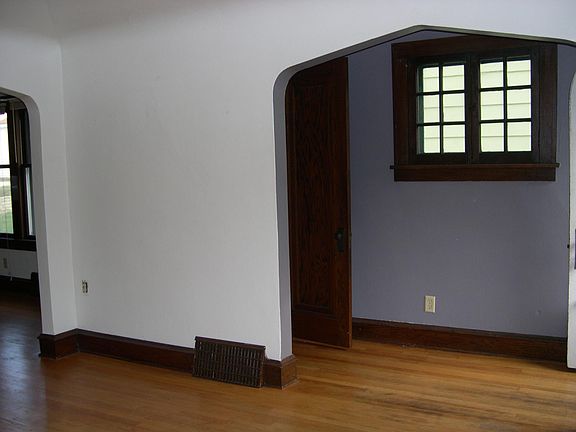 Living room & front entry w/closet.