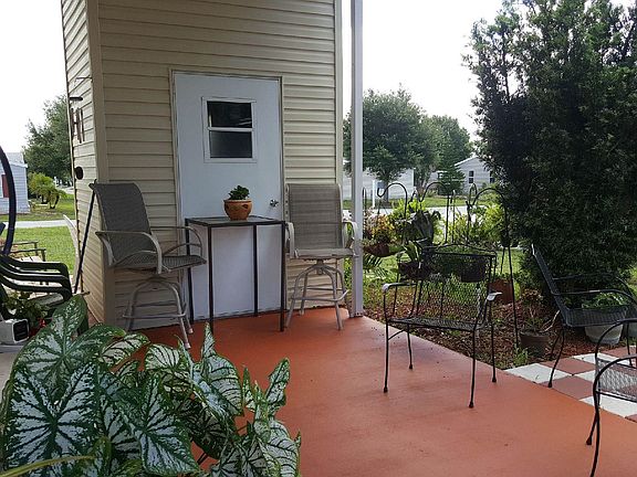 patio in carport, storage shed