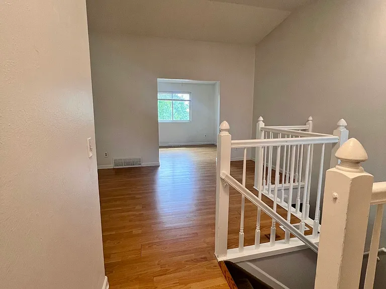 Once entering, the stairs is on the right side