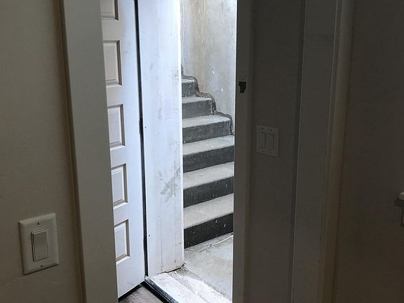 Electronic key pads on both the garage entry door and the ba