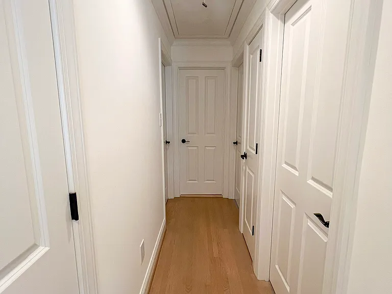 Hallway with Storage Closets and Bedrooms