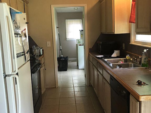 View from the dining room into the kitchen and laundry room