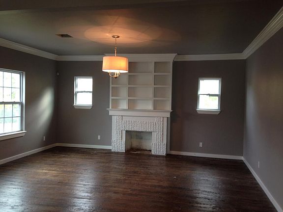 Handscraped Hardwoods with original fireplace