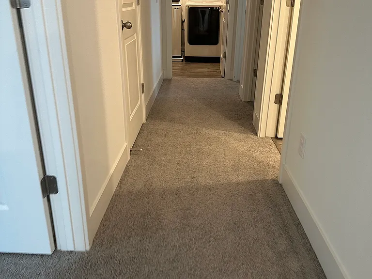 Upstairs hallway leading to laundry room