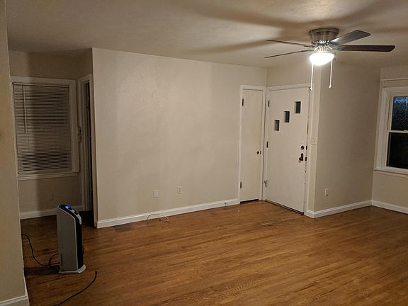 Front Entrance with Living Room. Stairs to basement.