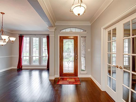 Tons of natural light in the entry way with engineered wood flooring throughout, your formal dining area.