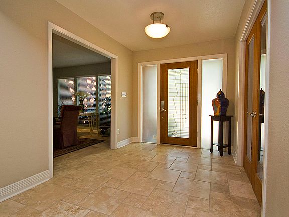 Enter the artistic front door to discover a warm  contemporary home.