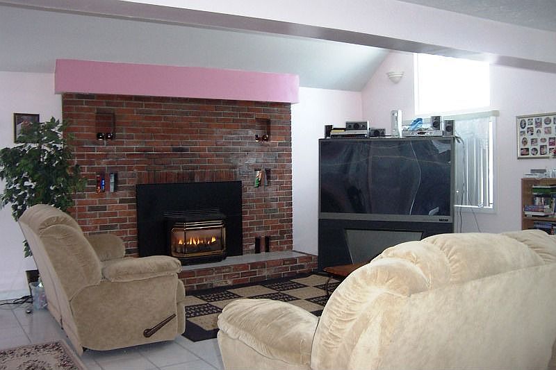 Spacious Tiled Family Room with cozy gas Fireplace