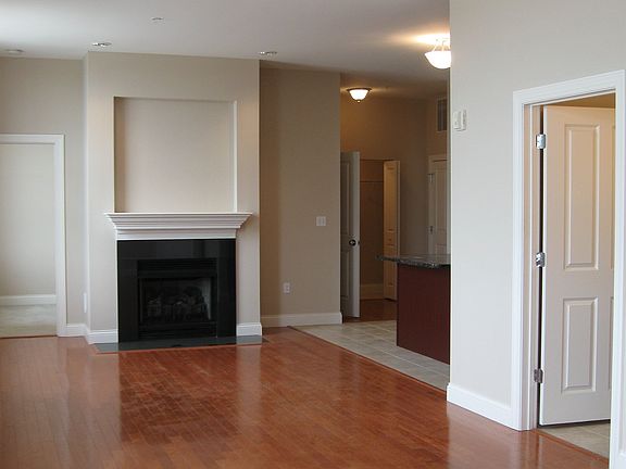Open Floor Plan with Hardwood Floors and Gas Fireplace