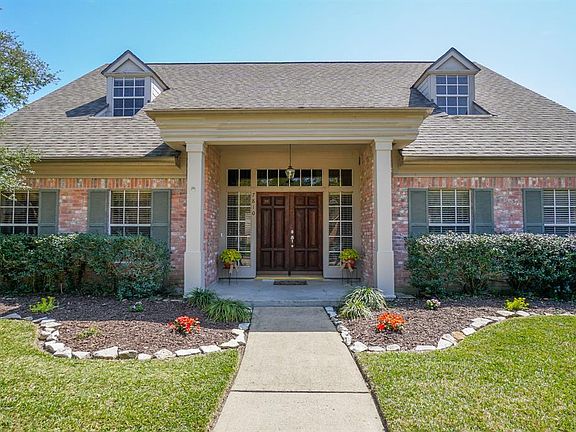 Impressive front entry with elegant double front doors.