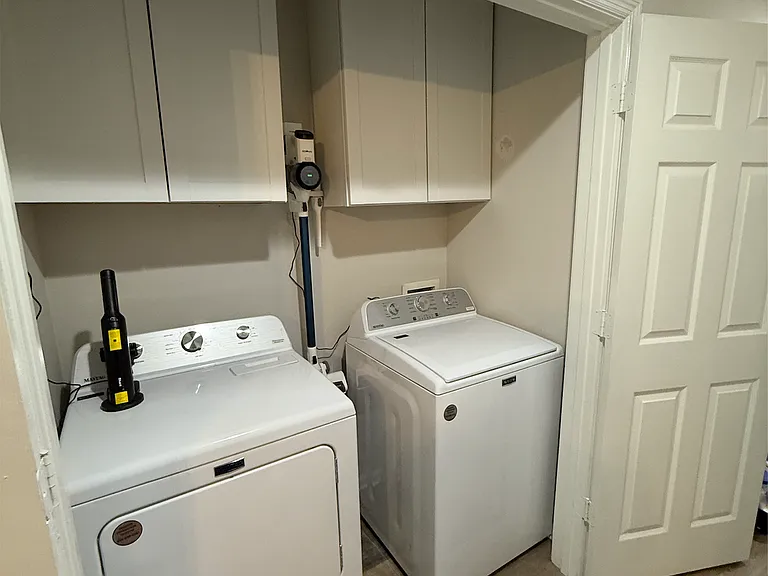 Storage mounted in laundry room, washer and dryer included in rental.